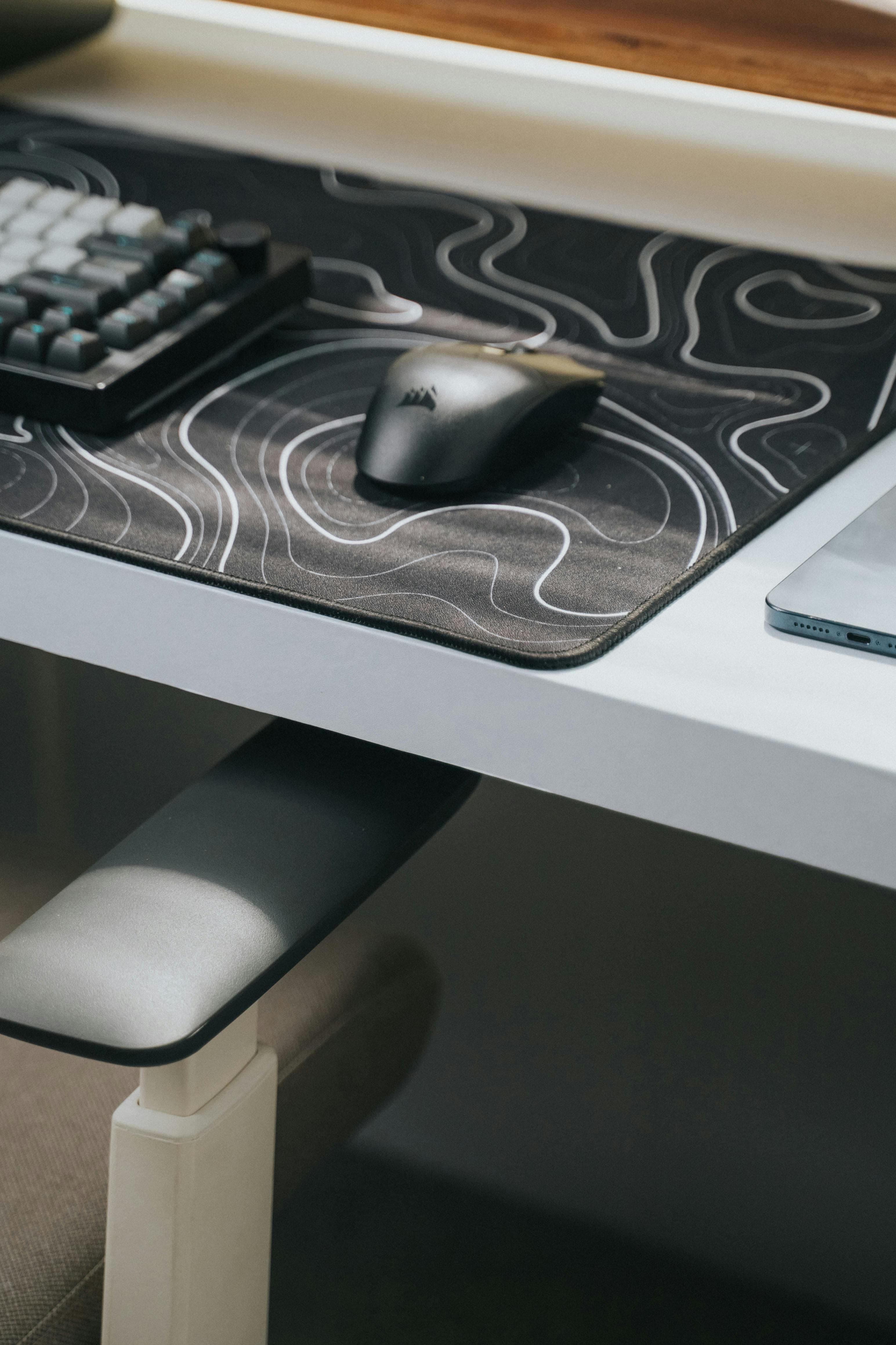Desk setup featuring a premium cloth mousepad and mouse.